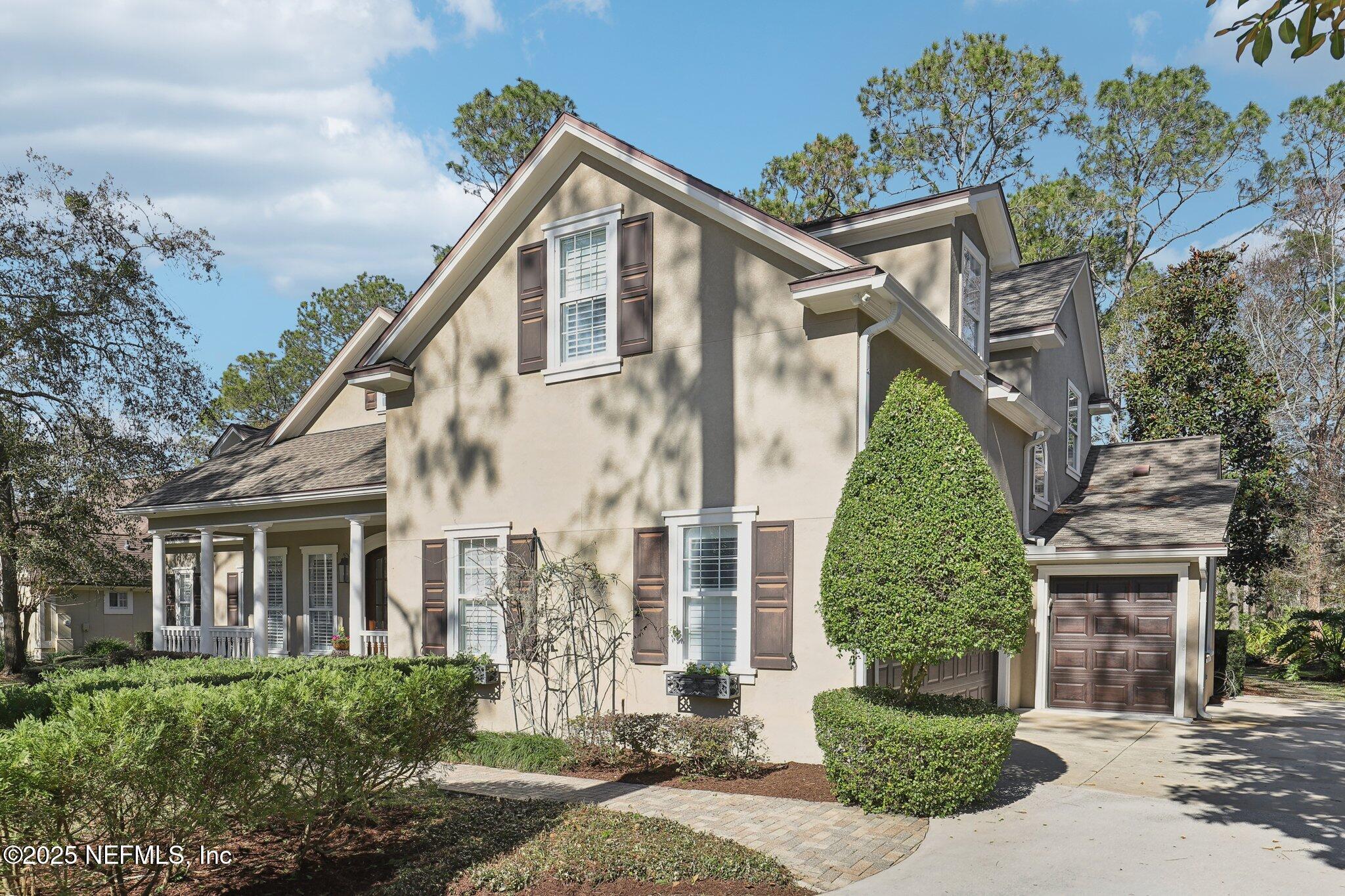 1836 Commodore Point Drive Fleming Island, FL 32003 - Photo 3 of 75 front view of a house with a tree