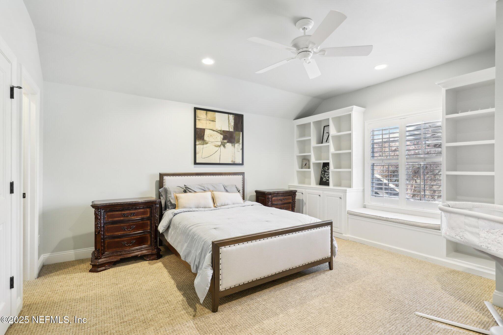 1836 Commodore Point Drive Fleming Island, FL 32003 - Photo 33 of 75 a bed sitting in a spacious bedroom next to a window