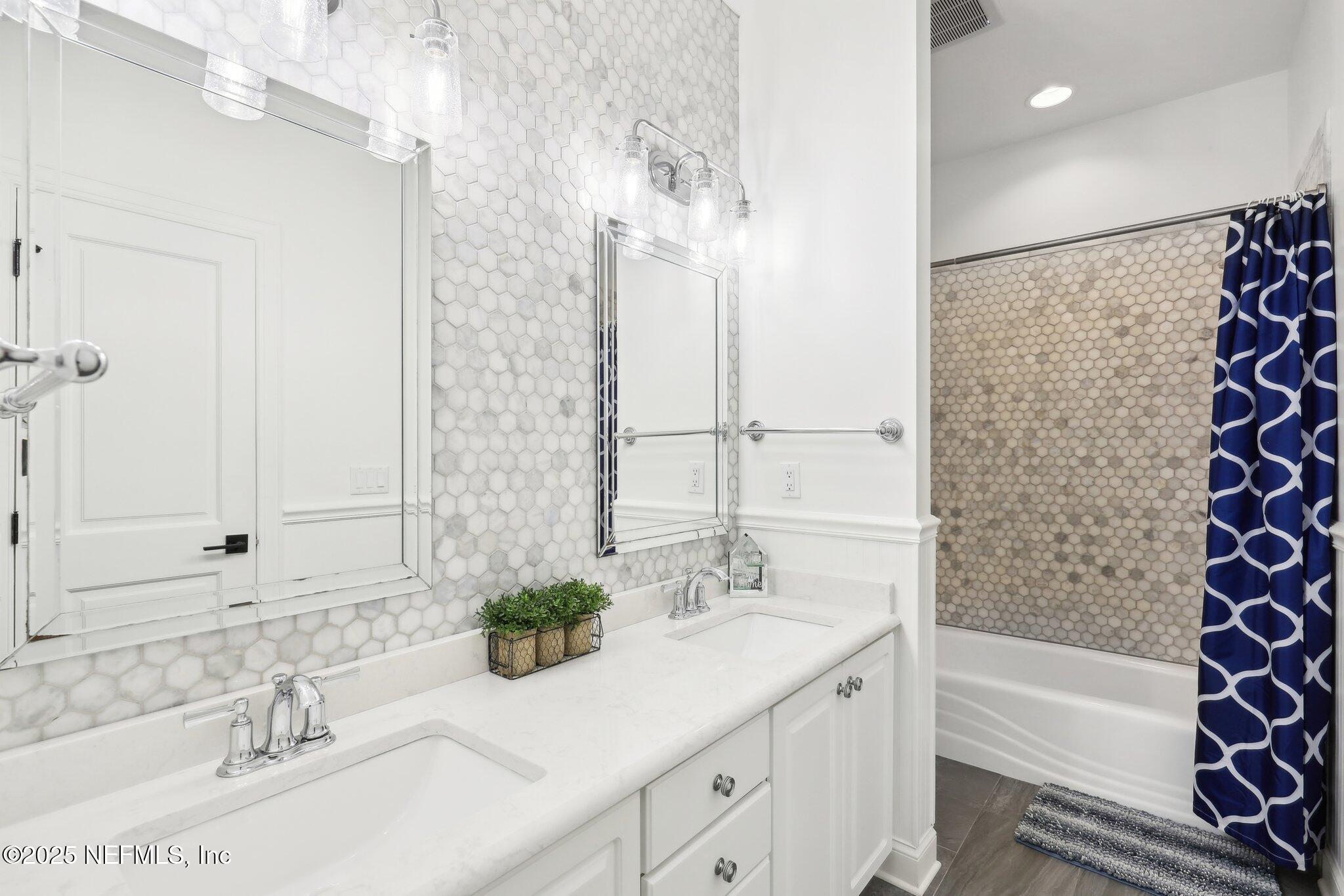 1836 Commodore Point Drive Fleming Island, FL 32003 - Photo 35 of 75 a bathroom with a granite countertop sink a toilet and shower