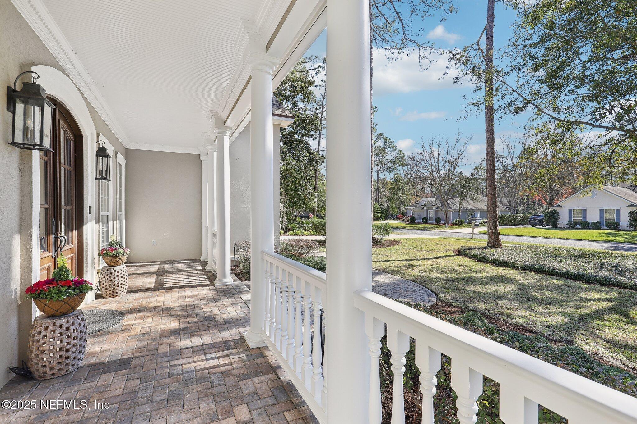 1836 Commodore Point Drive Fleming Island, FL 32003 - Photo 4 of 75 a view of a porch with a yard