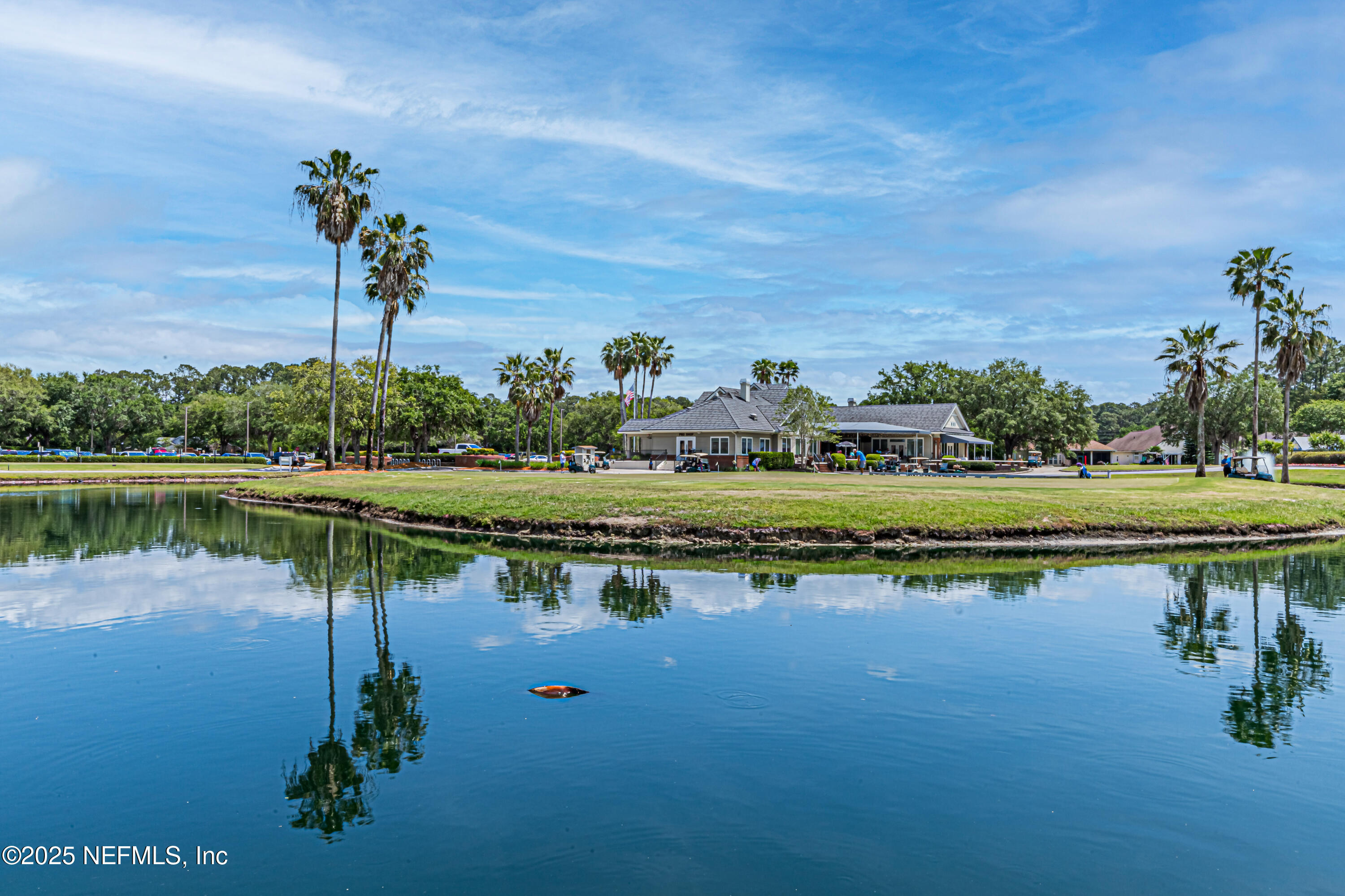 1836 Commodore Point Drive Fleming Island, FL 32003 - Photo 73 of 75 a view of a lake with a house in the background