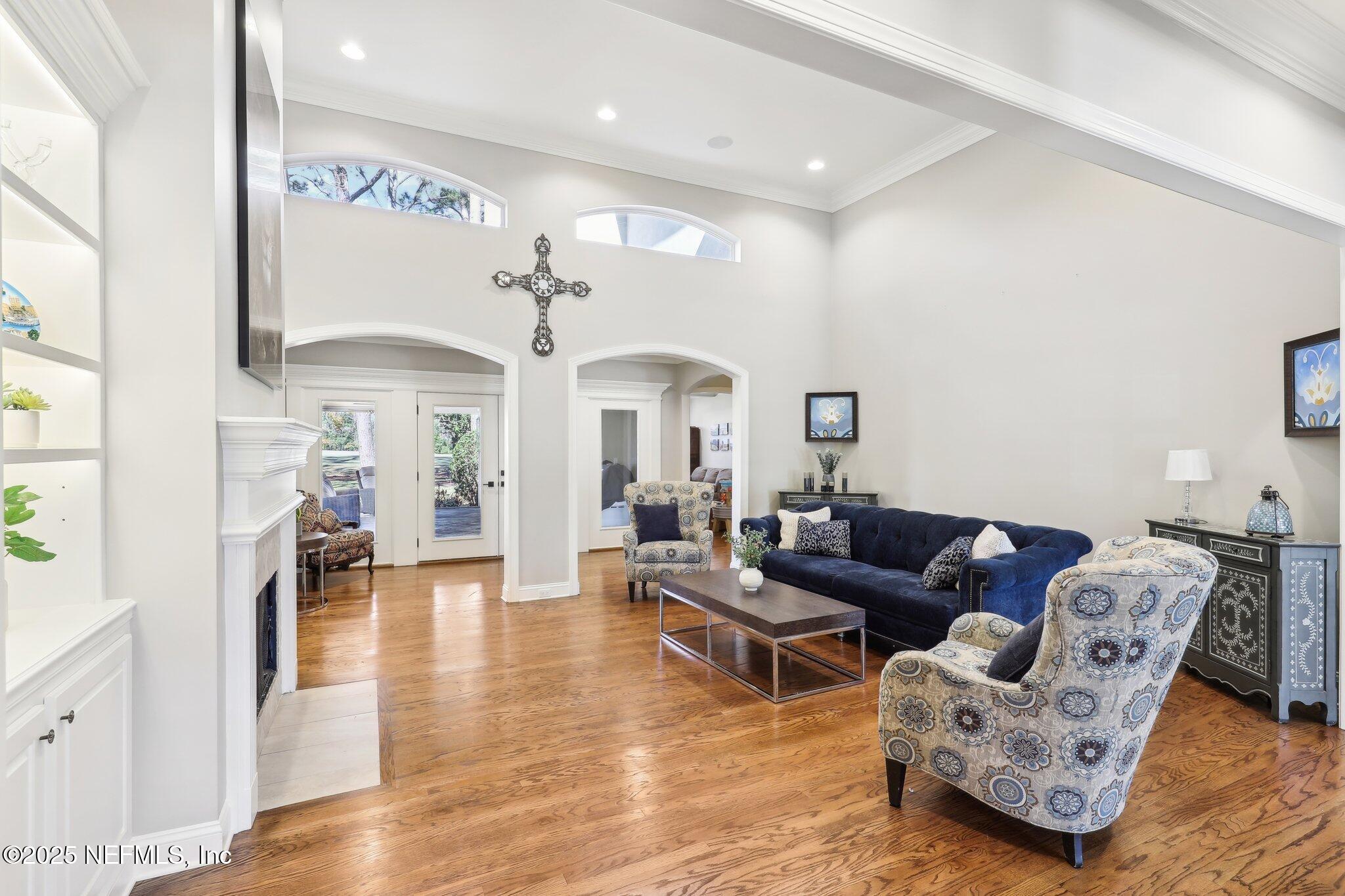 1836 Commodore Point Drive Fleming Island, FL 32003 - Photo 8 of 75 a living room with furniture and a chandelier