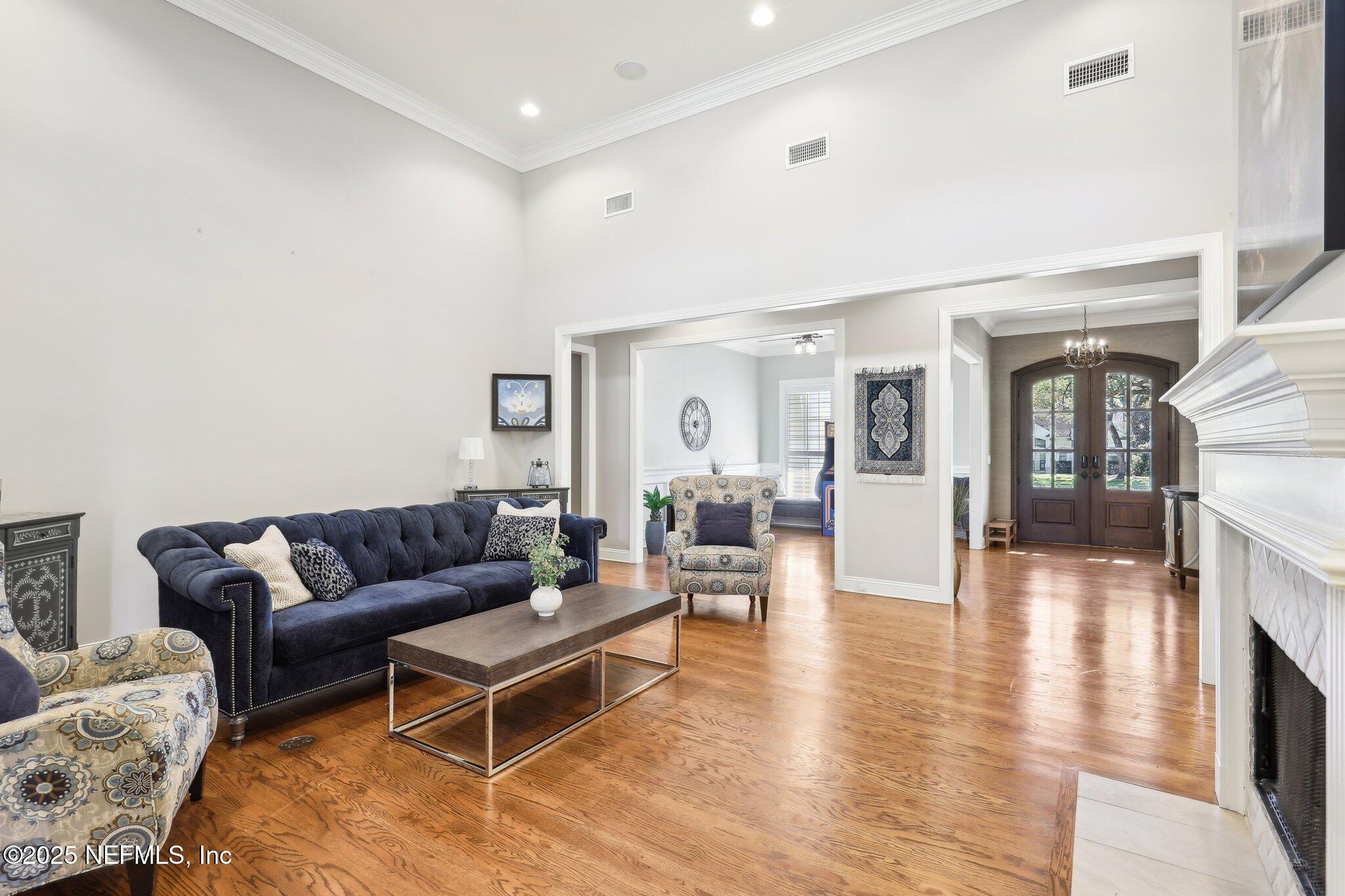 1836 Commodore Point Drive Fleming Island, FL 32003 - Photo 9 of 75 a living room with furniture and a wooden floor