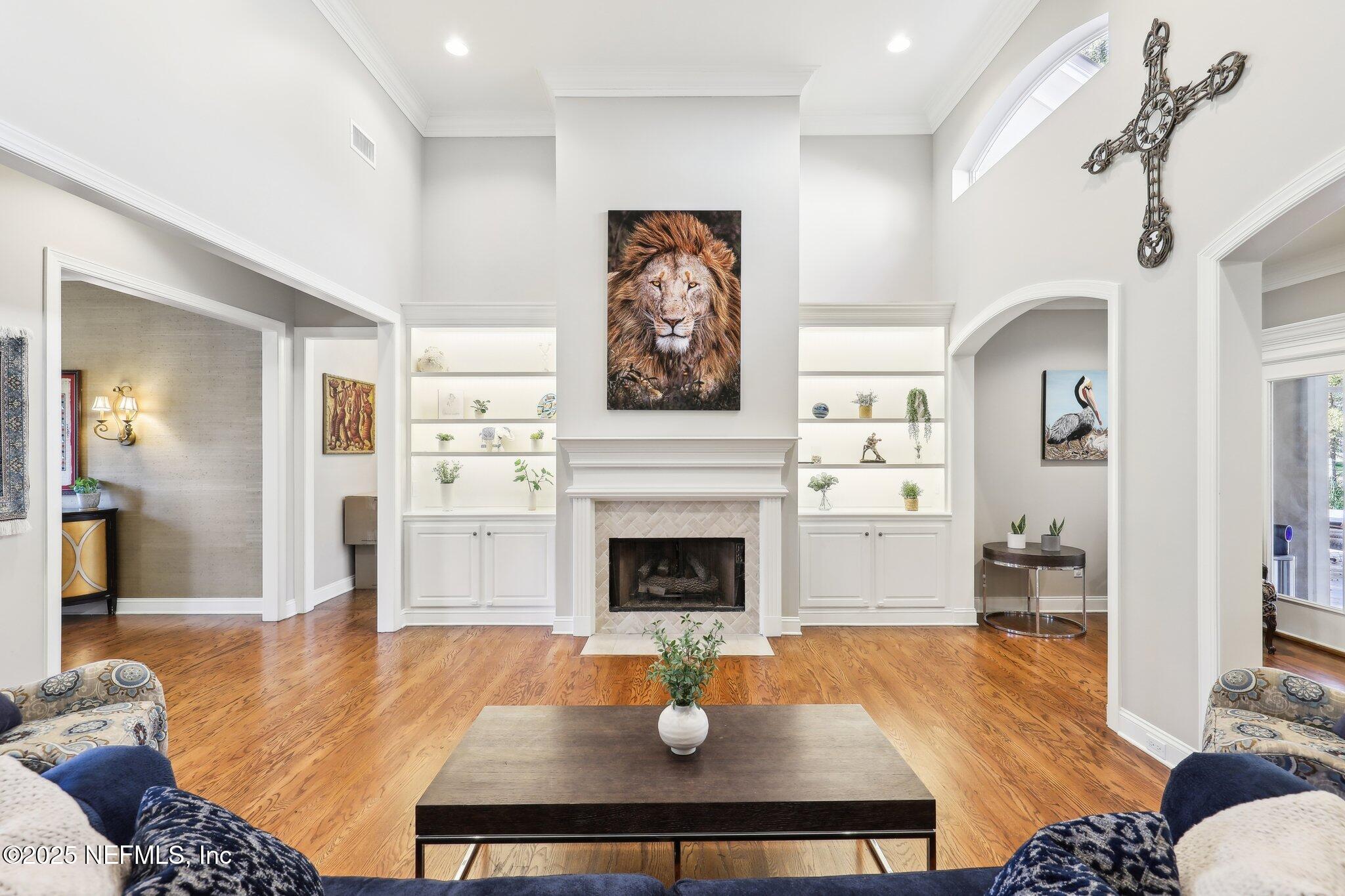 1836 Commodore Point Drive Fleming Island, FL 32003 - Photo 10 of 75 a living room with furniture and a fireplace