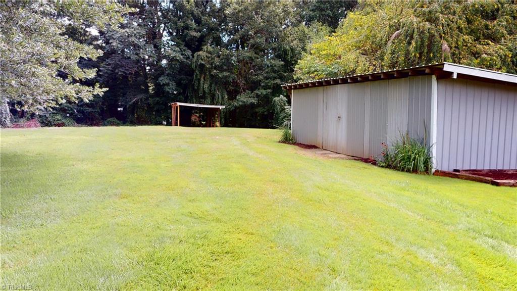 205 Fowler Circle Dobson, NC 27017 - Photo 6 of 29 Spacious FLAT backyard with storage building.