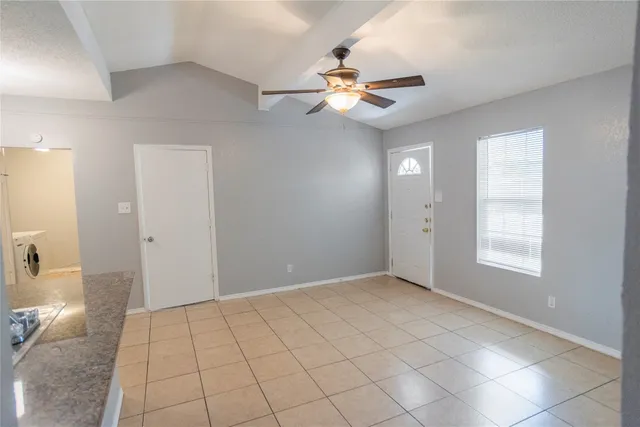 a view of an empty room and window
