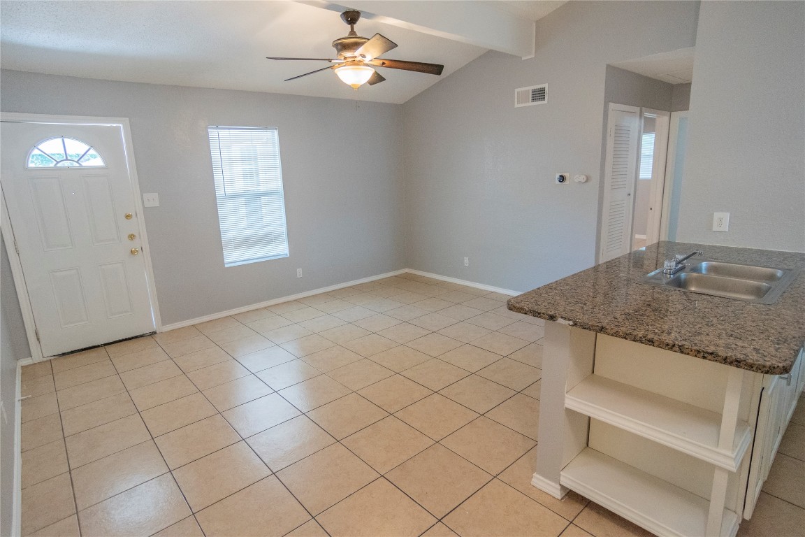 2913 East 51st Street, Unit B Austin, TX 78723 - Photo 5 of 12 an empty room with windows and ceiling fan