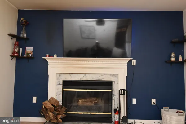 a kitchen with stainless steel appliances granite countertop a stove a sink and white cabinets