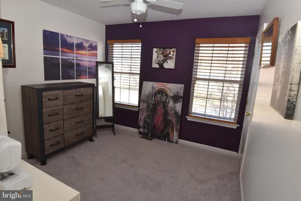 a view of a workspace with wooden floor