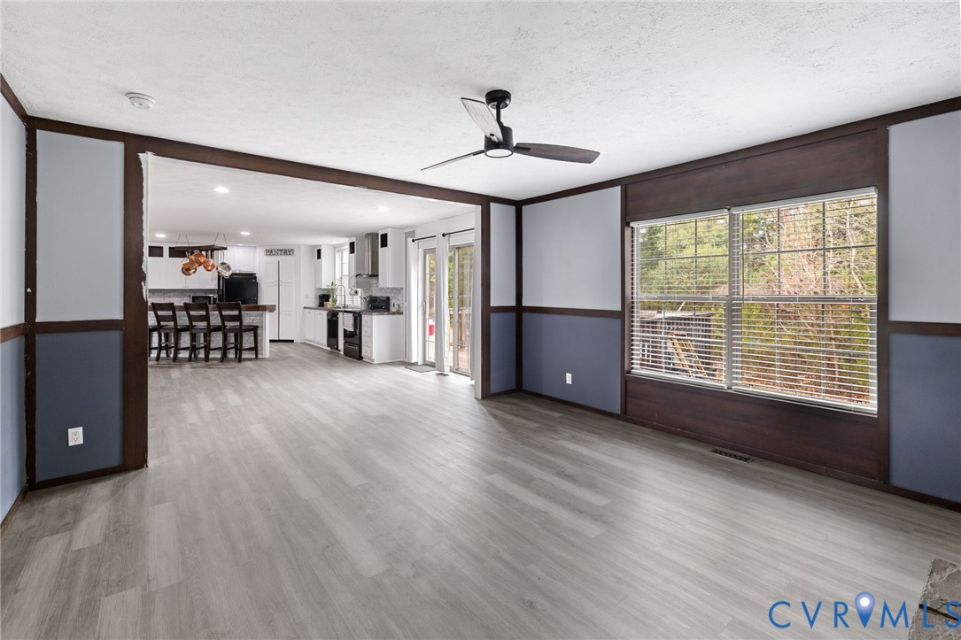 11391 Watkins Road Rockville, VA 23146 - Photo 14 of 28 a view of a livingroom with furniture wooden floor and a window