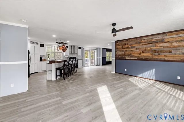 a view of a dining room with furniture wooden floor and chandelier