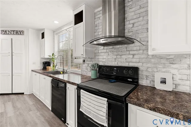 a kitchen with a stove and a sink