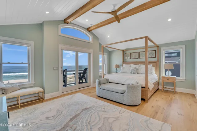 a bed room with furniture and a flat screen tv