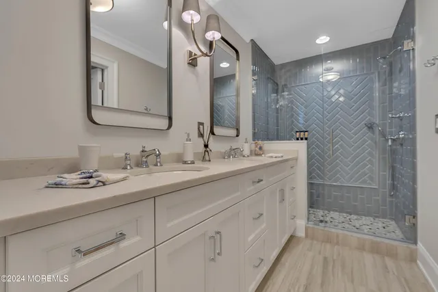 a bedroom with two beds and a large window