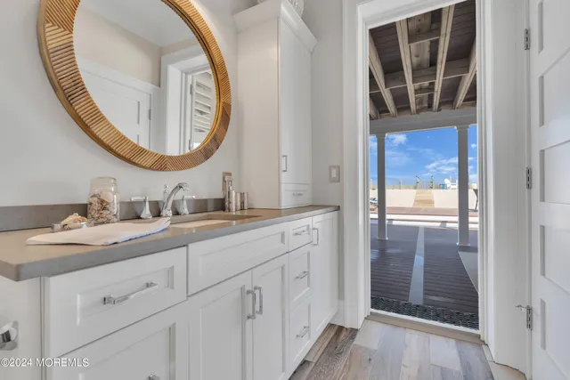 a view of an entryway with wooden floor