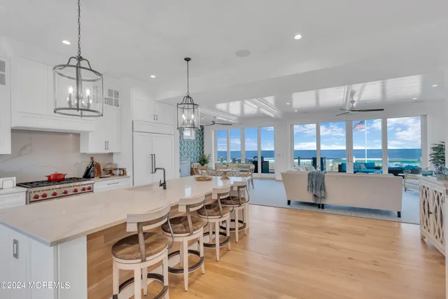 a large kitchen with a table and chairs