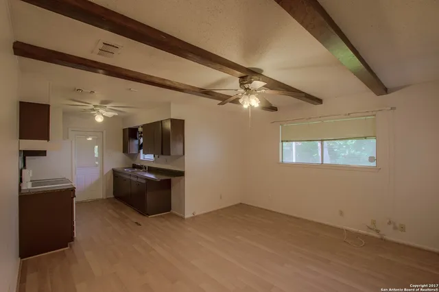 a kitchen with a stove and a refrigerator
