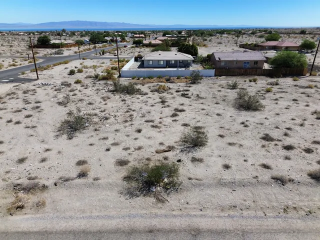 a view of beach and a yard