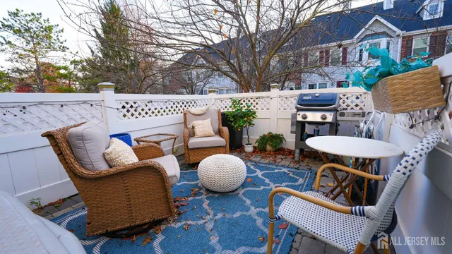 a view of a patio with couple of chairs