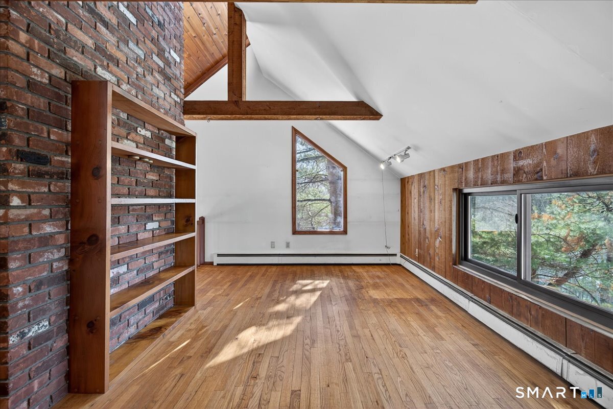 18 Deer Path Lane North Branford, CT 06471 - Photo 15 of 33 a view of room with window and wooden floor