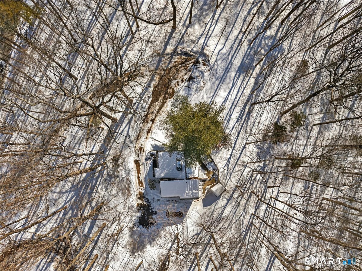 18 Deer Path Lane North Branford, CT 06471 - Photo 28 of 33 a backyard of a house with table and chairs