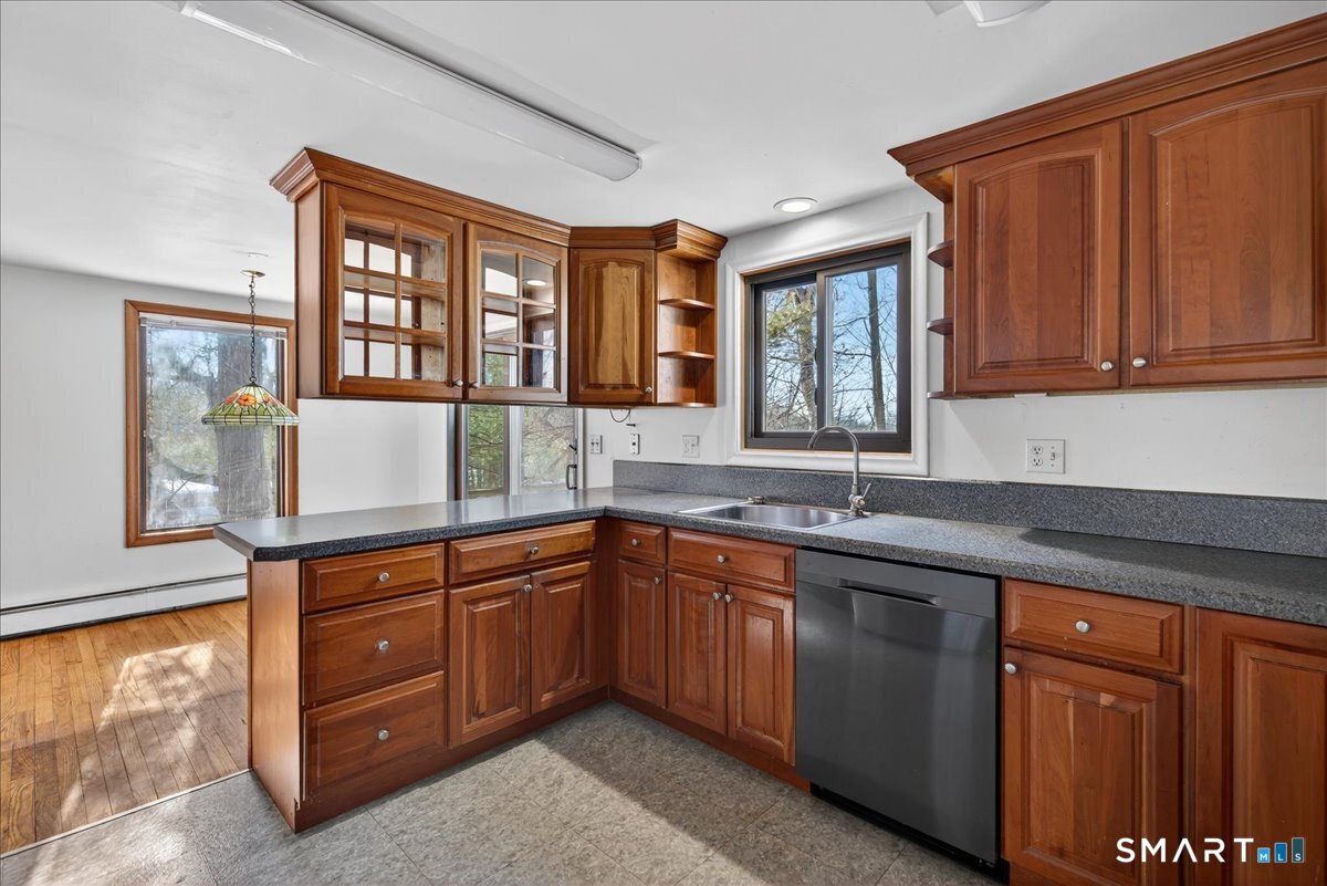 18 Deer Path Lane North Branford, CT 06471 - Photo 9 of 33 a kitchen with a sink and a window
