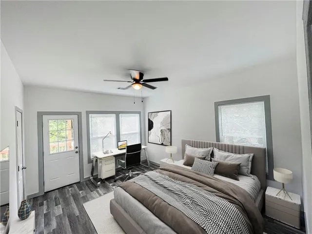 a bedroom with a bed and a window