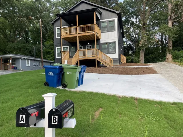 a front view of a house with garden