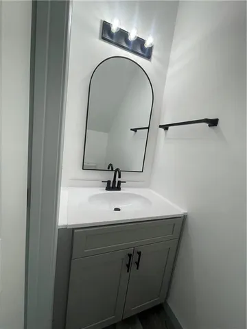 a bathroom with a sink and a mirror