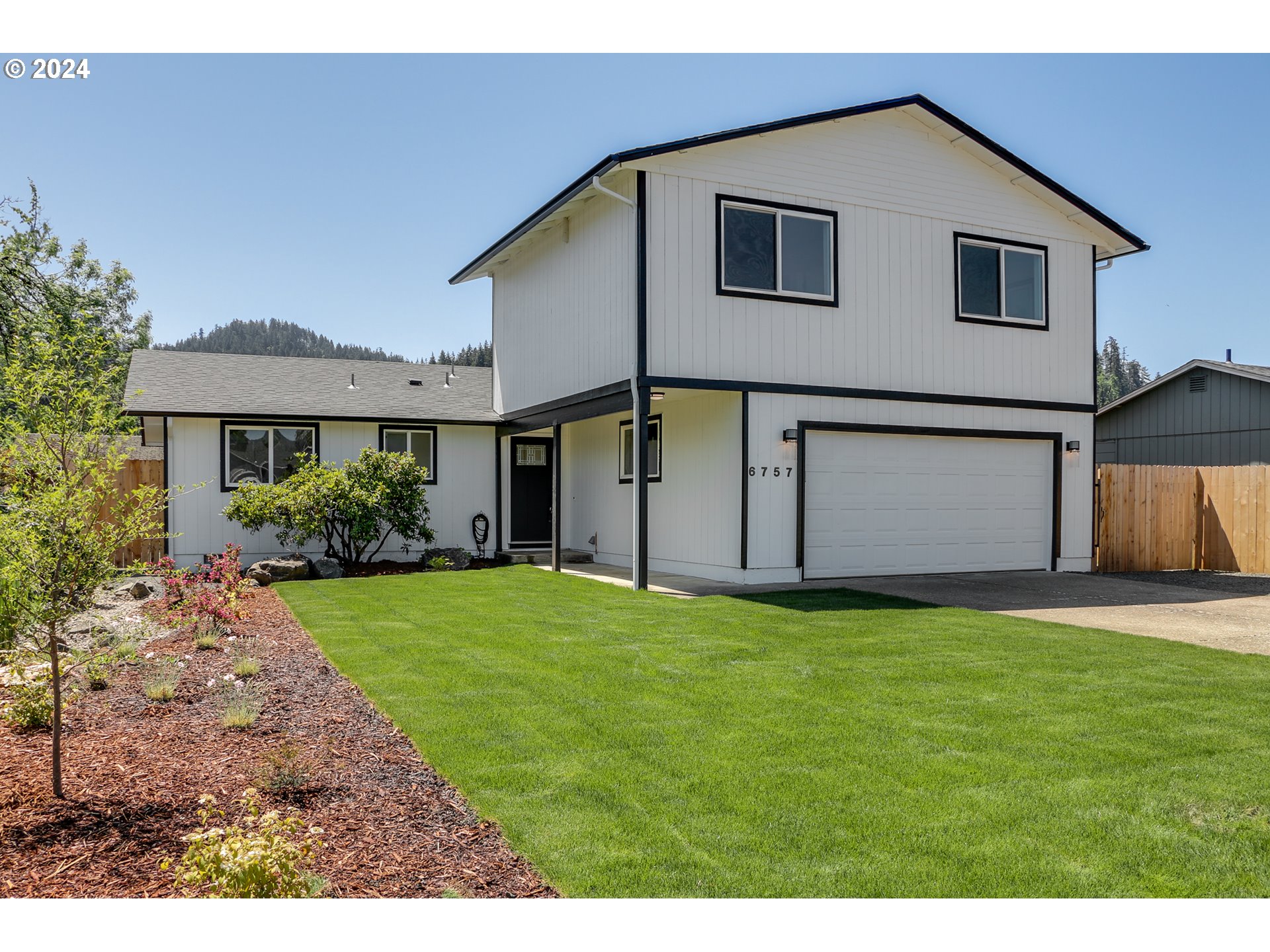 6757 A Street Springfield, OR 97478 - Photo 1 of 25 a house view with a garden space
