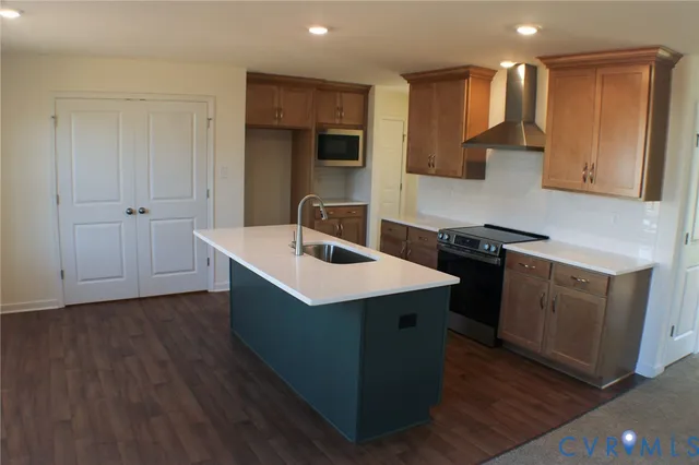 a kitchen with a sink stove and cabinets