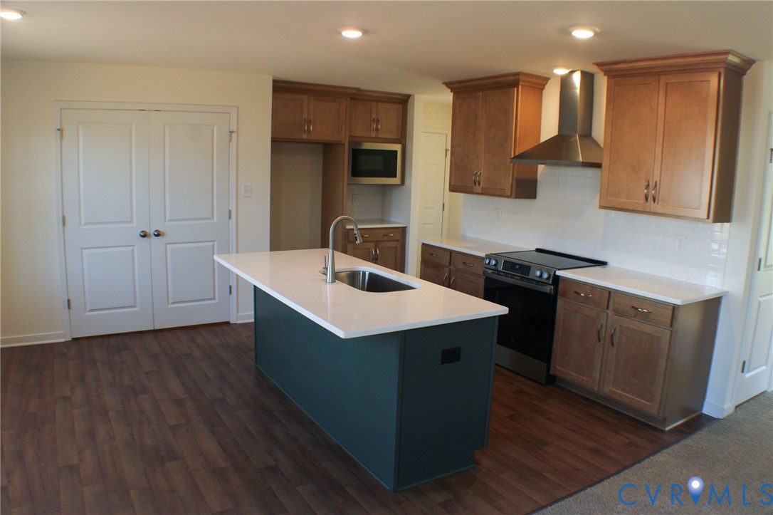 8249 Reedy Knl Drive Richmond, VA 23237 - Photo 3 of 11 a kitchen with a sink stove and cabinets