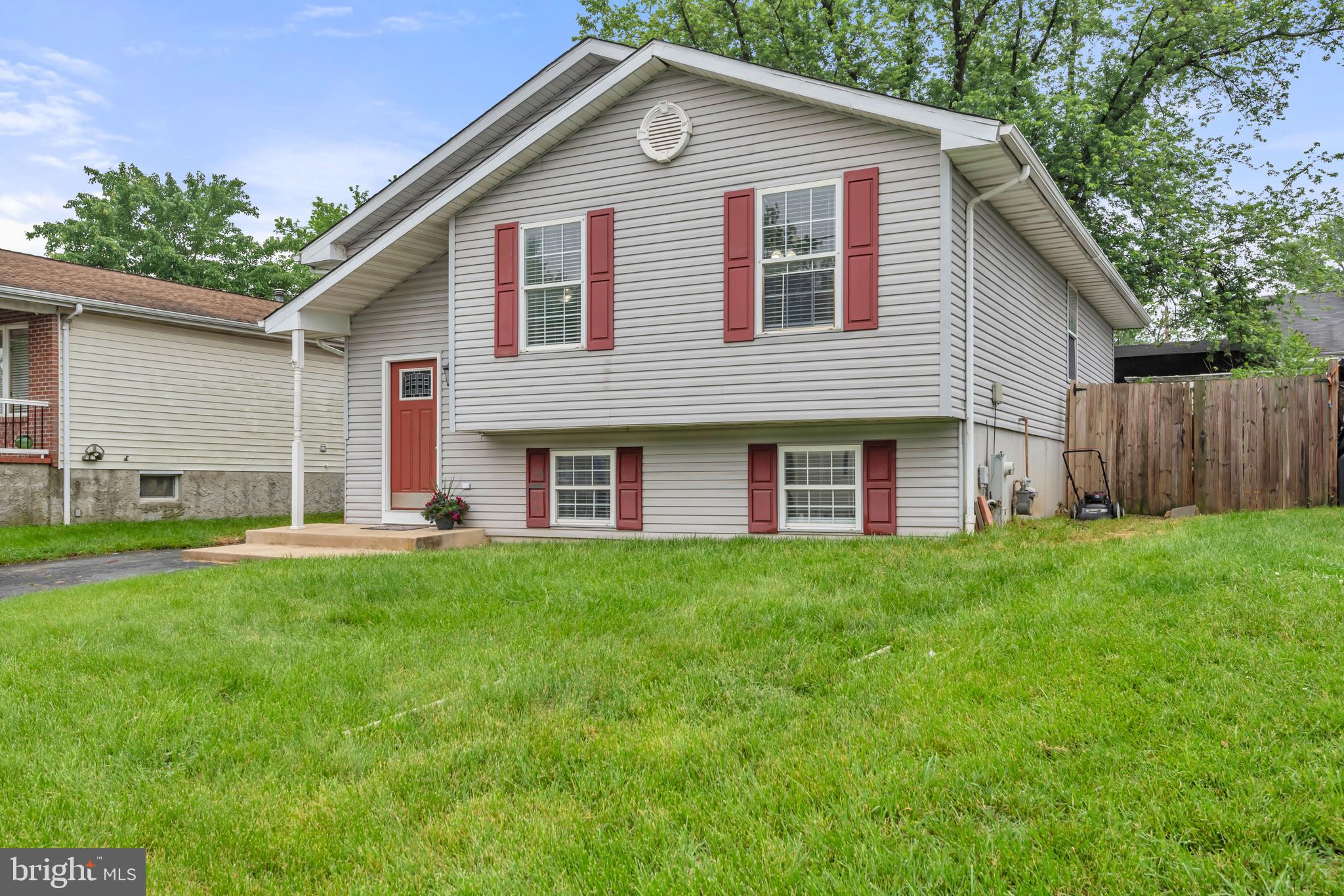 1223 Kendrick Road Baltimore, MD 21237 - Photo 2 of 36 a front view of a house with a yard
