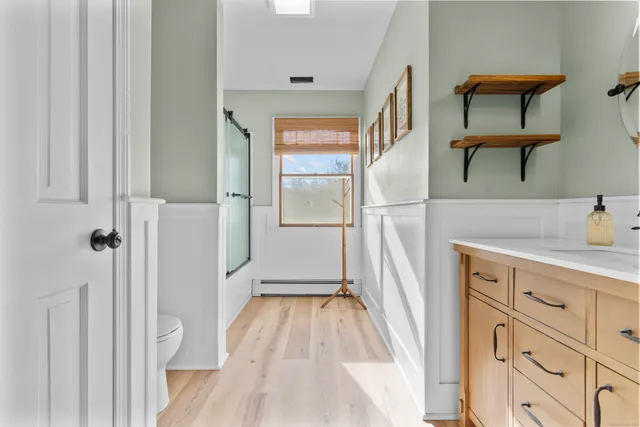 a view of empty room with white walls