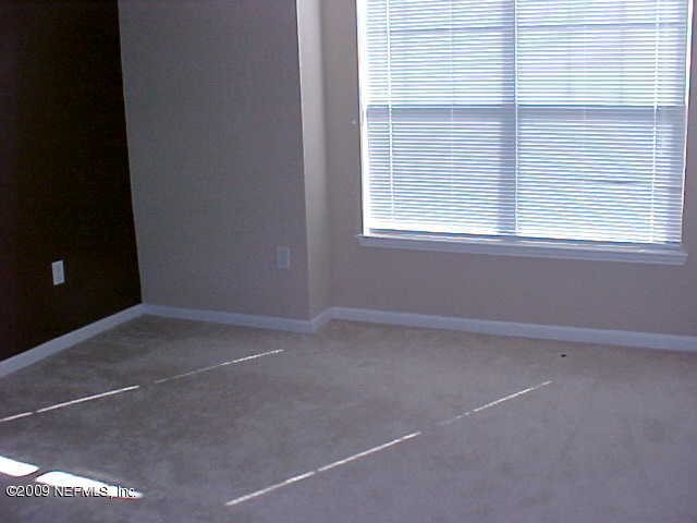 10200 Belle Rive Boulevard, Unit 4702 Jacksonville, FL 32256 - Photo 6 of 10 a view of empty room with window