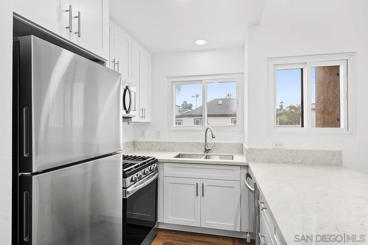 2742 A Street, Unit 202 San Diego, CA 92102 - Photo 11 of 22 a kitchen with a refrigerator sink and stove