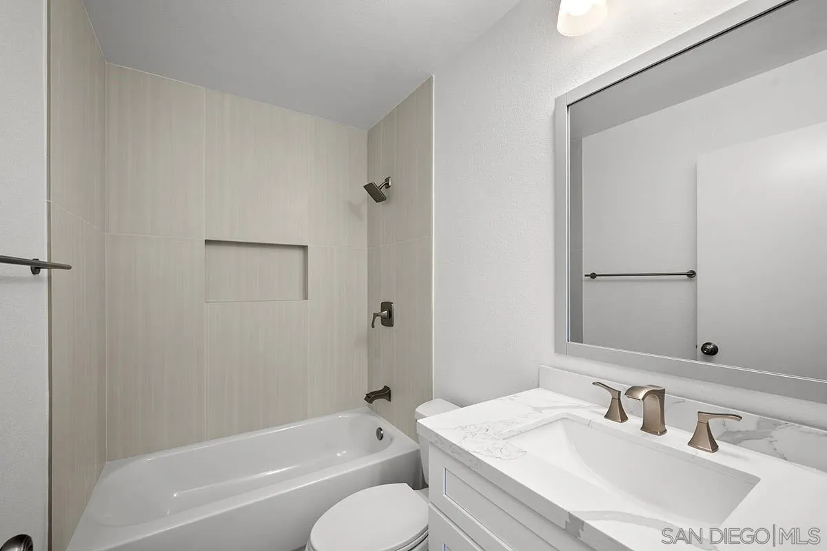2742 A Street, Unit 202 San Diego, CA 92102 - Photo 14 of 22 a bathroom with a granite countertop sink toilet and shower