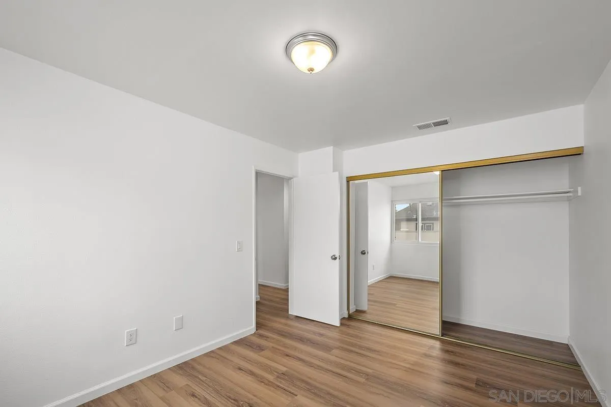 2742 A Street, Unit 202 San Diego, CA 92102 - Photo 16 of 22 a view of an empty room with wooden floor