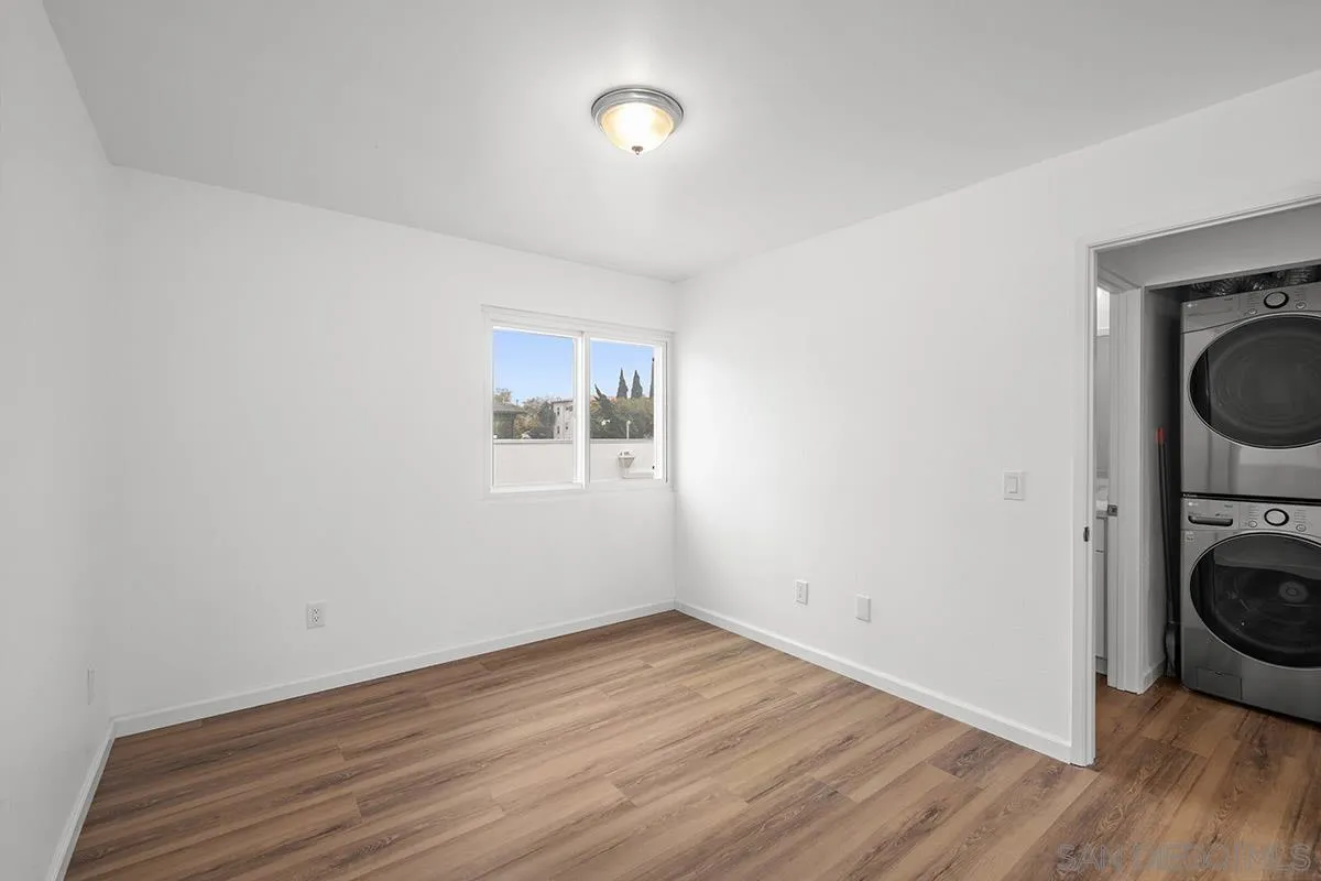 2742 A Street, Unit 202 San Diego, CA 92102 - Photo 17 of 22 a view of a room with wooden floor and washing machine