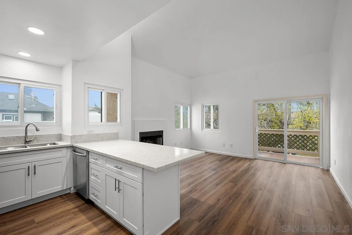 2742 A Street, Unit 202 San Diego, CA 92102 - Photo 5 of 22 a kitchen with a sink window and cabinets