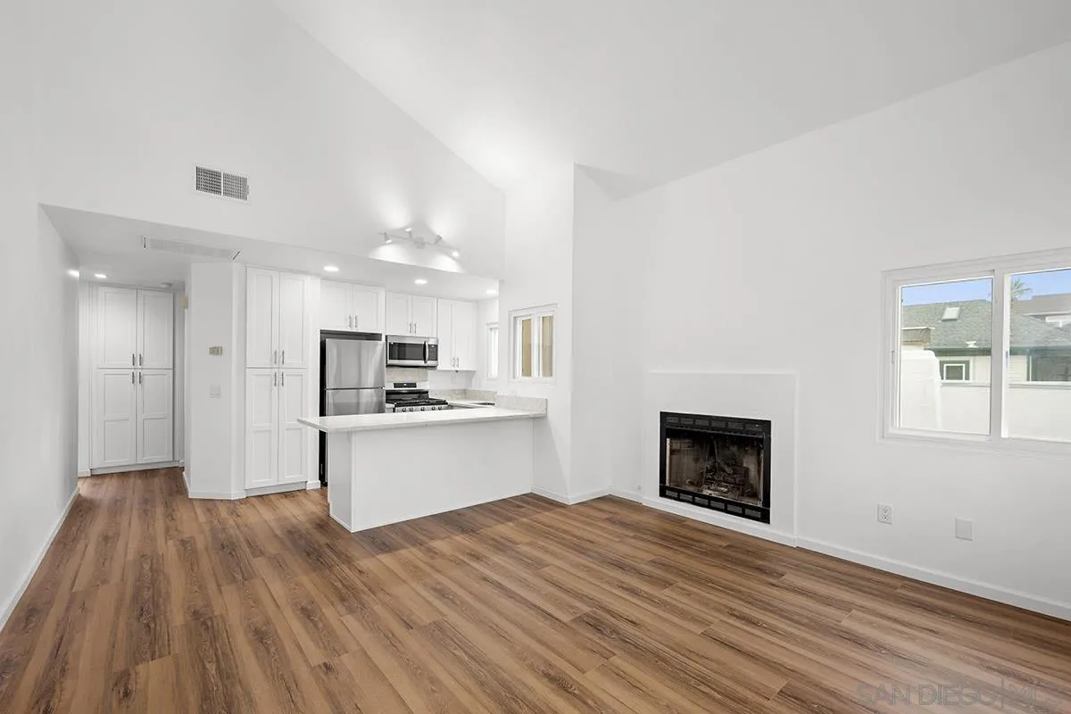 2742 A Street, Unit 202 San Diego, CA 92102 - Photo 6 of 22 a open kitchen with a white stove top oven and refrigerator