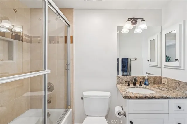 a bathroom with a table and a chair