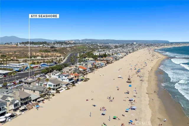 an aerial view of beach and city