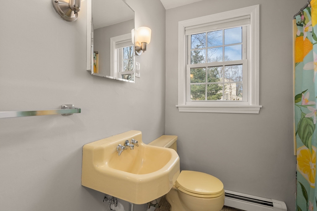 31 Sunset Drive Northborough, MA 01532 - Photo 16 of 33 a bathroom with a sink a mirror and a toilet