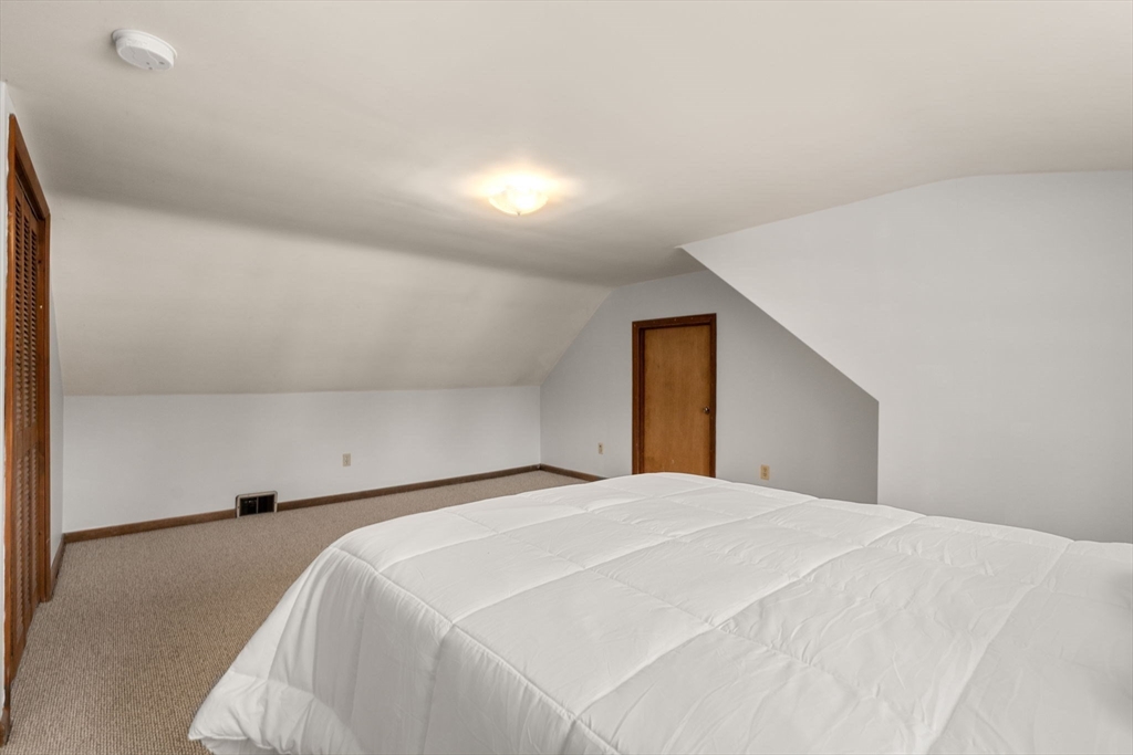 31 Sunset Drive Northborough, MA 01532 - Photo 19 of 33 a bedroom with a bed and a window