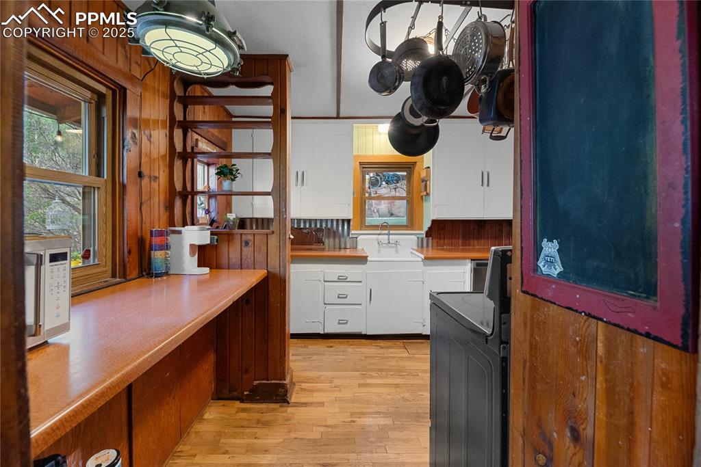 9270 Picabo Road Cascade, CO 80809 - Photo 11 of 31 a kitchen with a sink cabinets and a stove