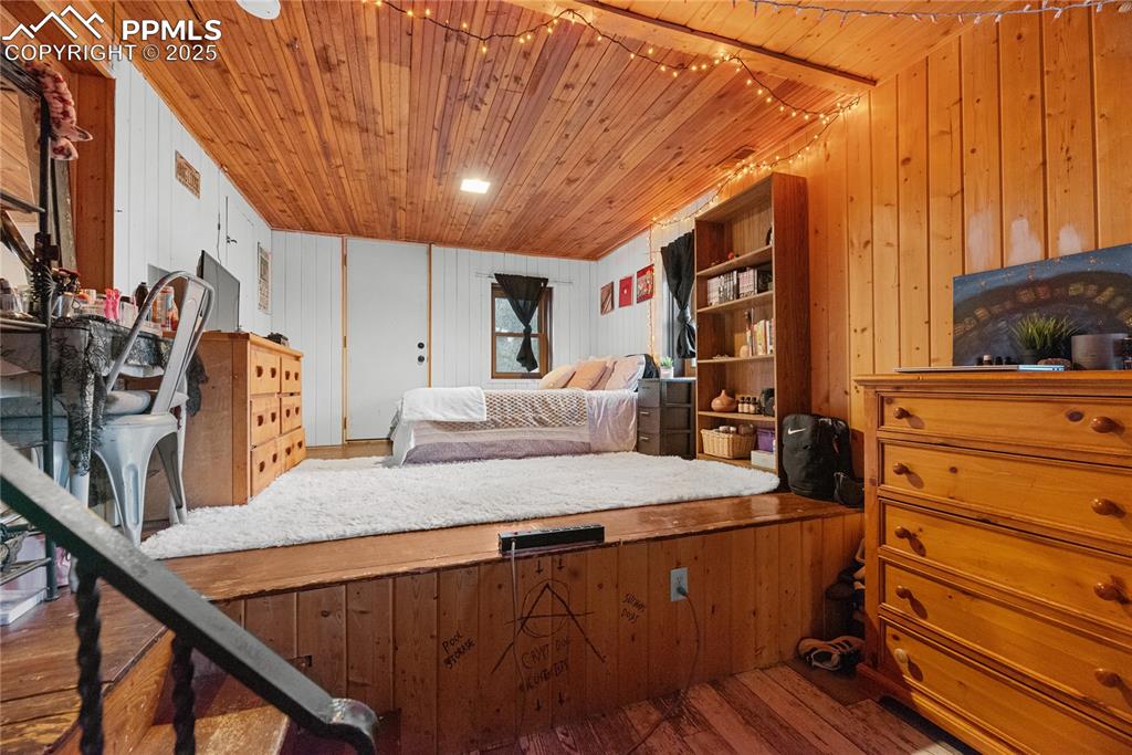 9270 Picabo Road Cascade, CO 80809 - Photo 19 of 31 a bed room with a bed and a television