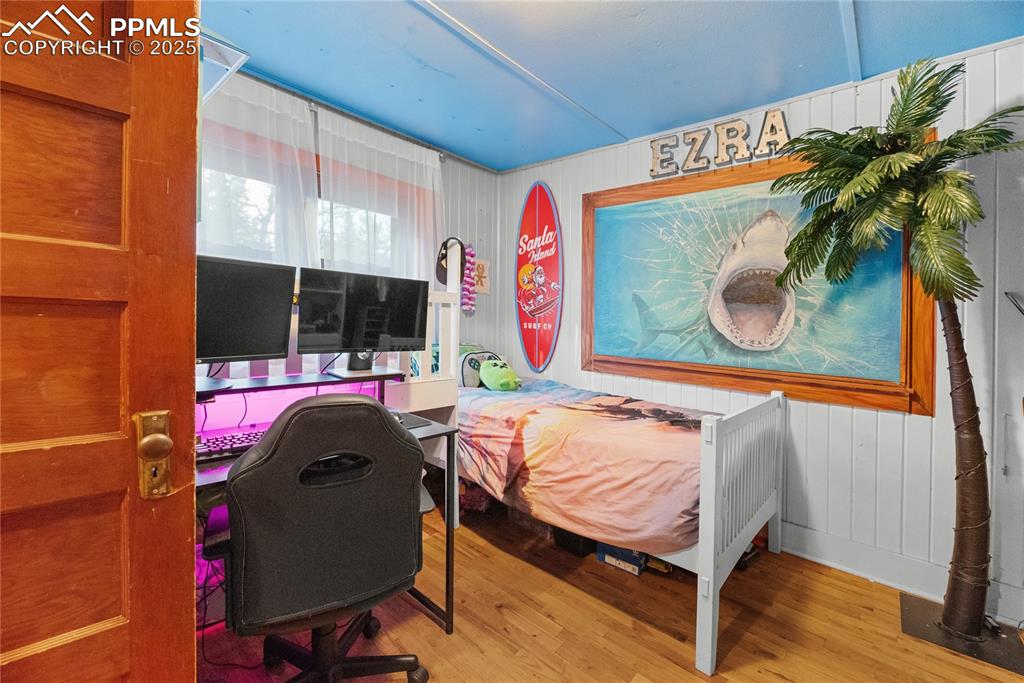 9270 Picabo Road Cascade, CO 80809 - Photo 22 of 31 a bedroom with a bed and a painting on the wall