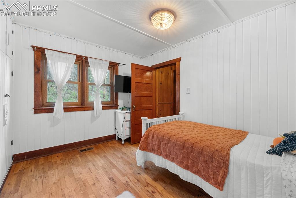 9270 Picabo Road Cascade, CO 80809 - Photo 23 of 31 a bedroom with a bed and window