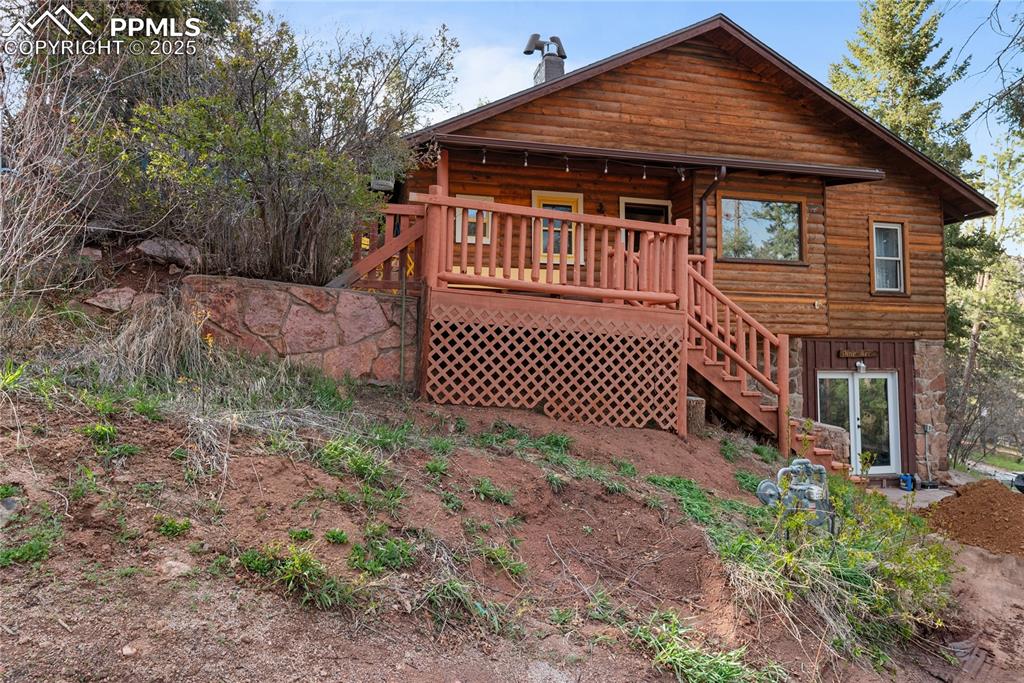 9270 Picabo Road Cascade, CO 80809 - Photo 3 of 31 a front view of a house with garden